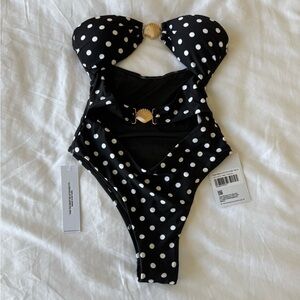 Princess Polly Black one piece swimsuit with White Polka Dots and gold sea shell